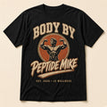 Peptide Mike Tee – Vintage Gym Badge, classic-physique bodybuilder badge print on a black tee
