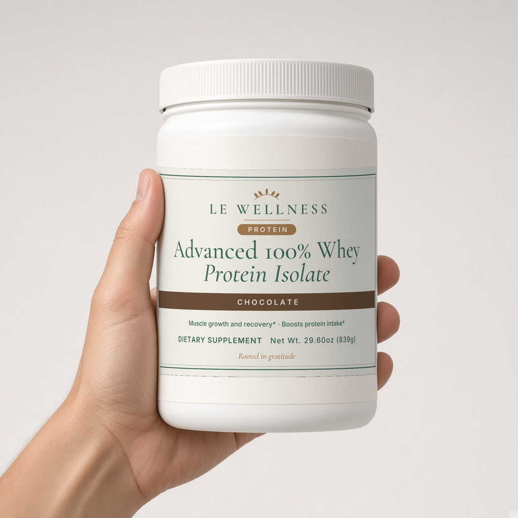 Hand holding Le Wellness Advanced 100% Whey Protein Isolate (Chocolate) tub