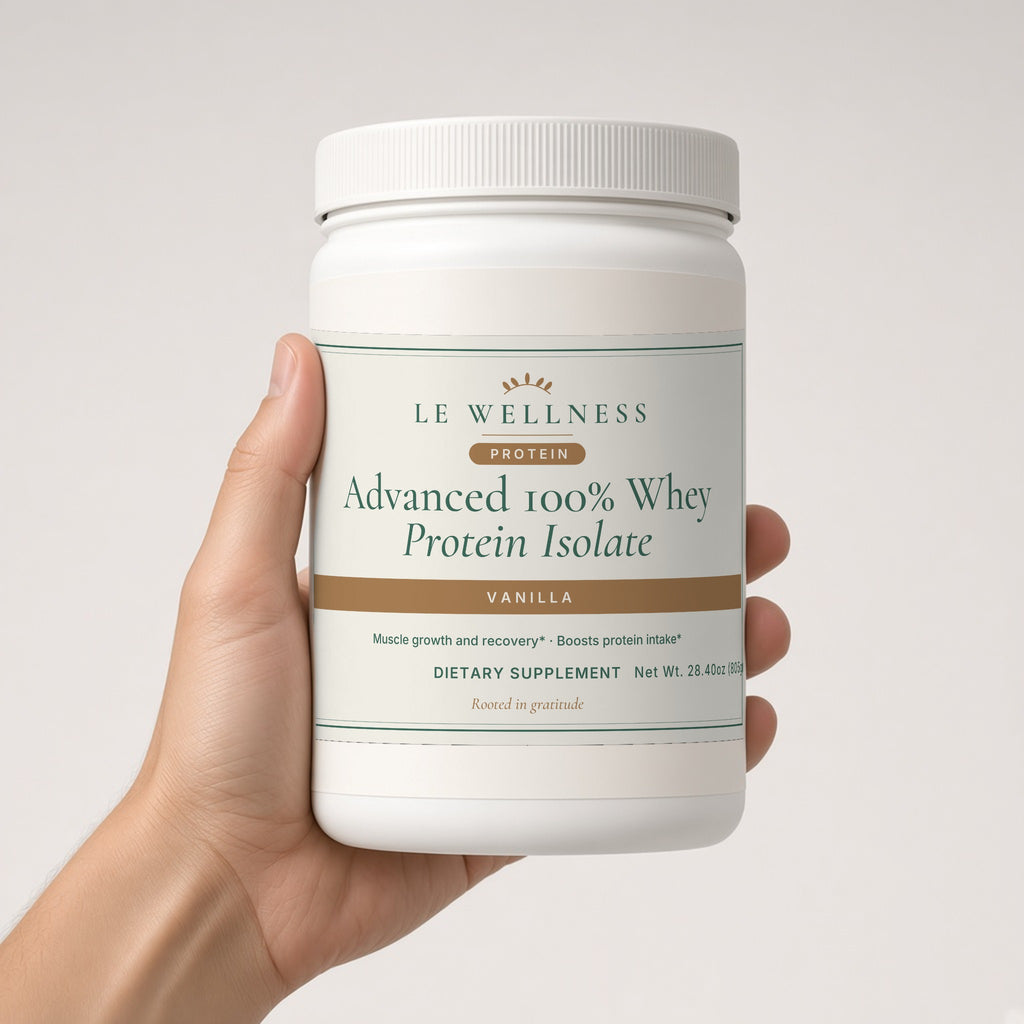 Hand holding Le Wellness Advanced 100% Whey Protein Isolate (Vanilla) tub